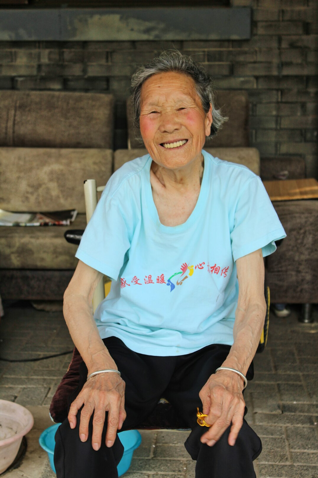Smiling elderly Japanese woman in casual clothing
