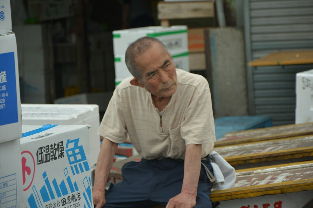 Smiling elderly Japanese man in casual clothing