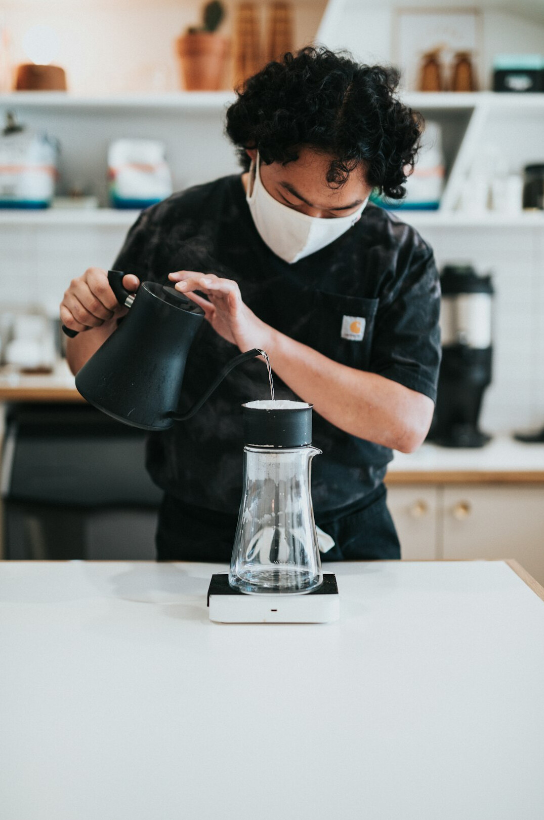 barista pouring coffee